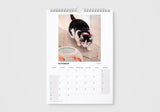 Calendar page for November with a cat on a gray background