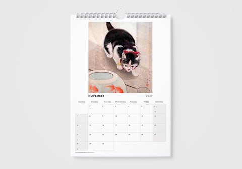 Calendar page for November with a cat on a gray background