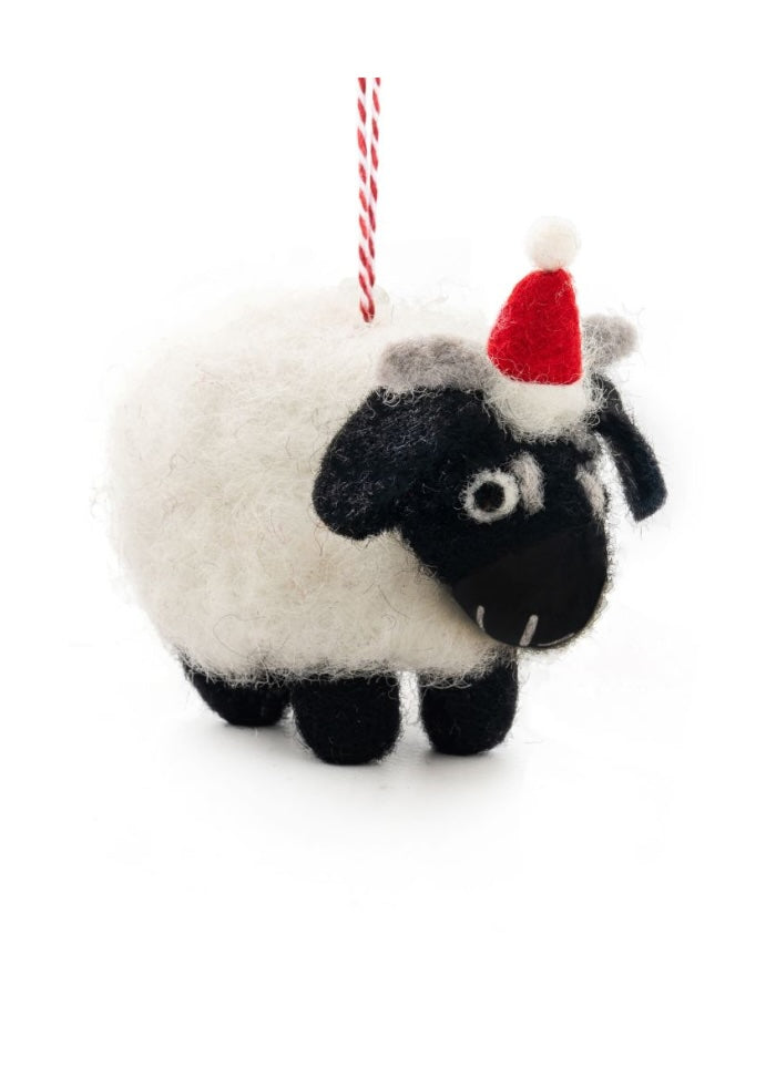Felt decoration of a sheep with black face and feet