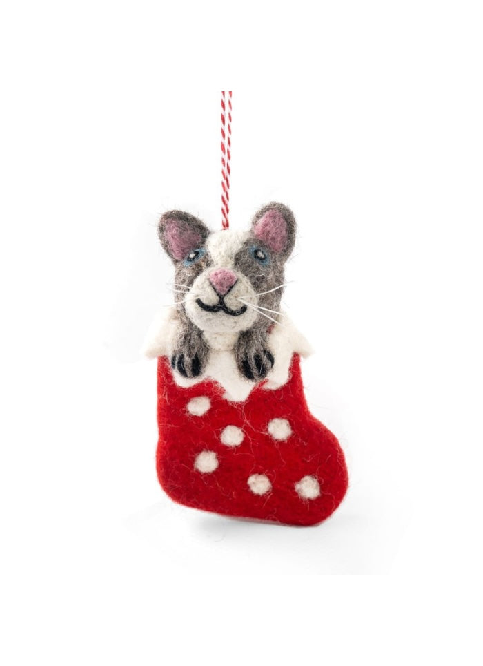 Felted wool cat in a red stocking with white polka dots on a white background