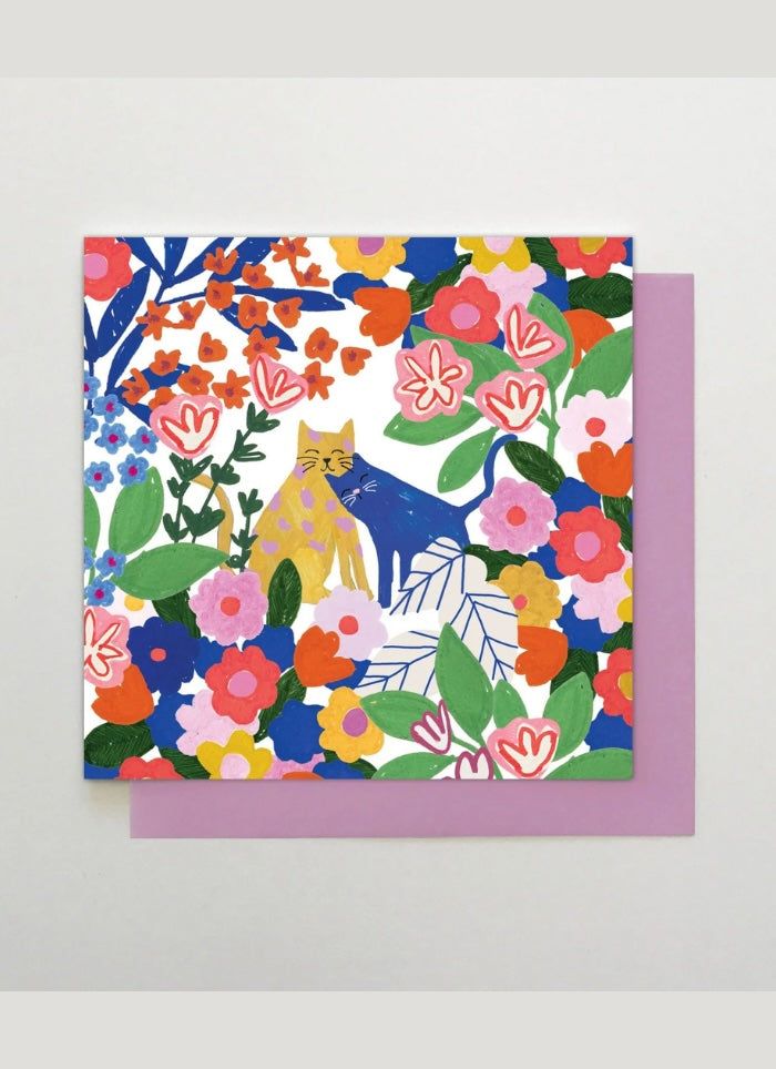 Square card with brightly coloured illustration of cats in flowers