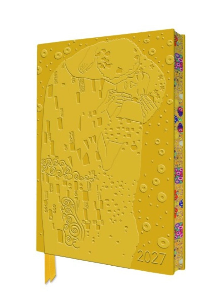 Yellow embossed notebook with a design and '2027' printed on it, on a white background