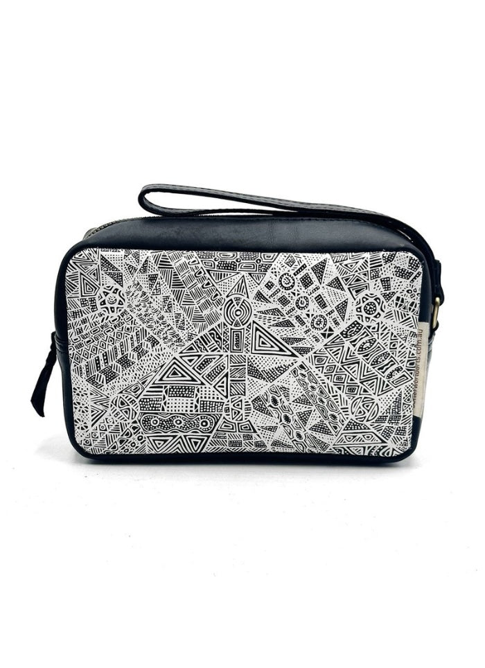 Small black handbag with a white geometric pattern on a white background