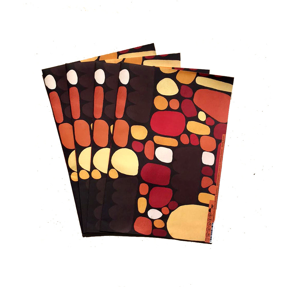 A stack of four patterned art prints or postcards fanned out on a white background. The designs feature abstract organic shapes in red, orange, yellow, and white on dark brown and black backgrounds.