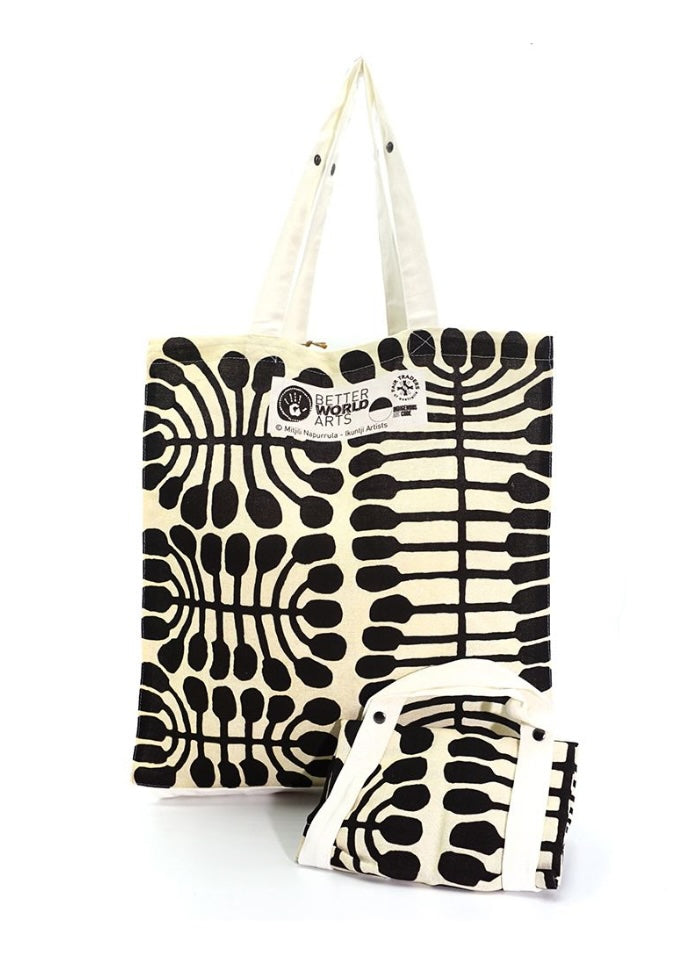 Black and white foldable cotton bag featuring artwork by Mitjili Napuluma