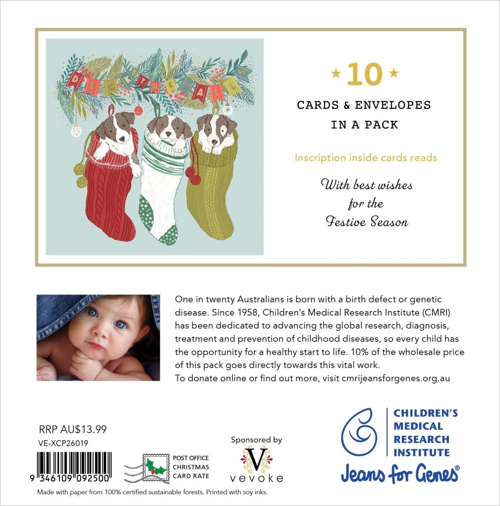 Back of a Christmas-themed card pack insert showing 10 cards and envelopes in a pack, with holiday illustrations of three dogs in red, green, and white stockings, product text, a small baby photo, and sponsor logos including Children's Medical Research Institute and Jeans for Genes.