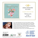 Christmas card packaging with candy canes and a baby photo, featuring Children's Medical Research Institute branding.