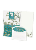 Set of stationery items with floral design on a white background