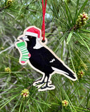 Christmas decoration Earth Greetings Magpie - bird in a ha hanging on a tree.