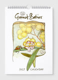 Calendar cover with 'Gumnut Babies' illustration featuring two baby characters on a branch with flowers.