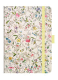 Floral-patterned notebook with a yellow strap on a white background