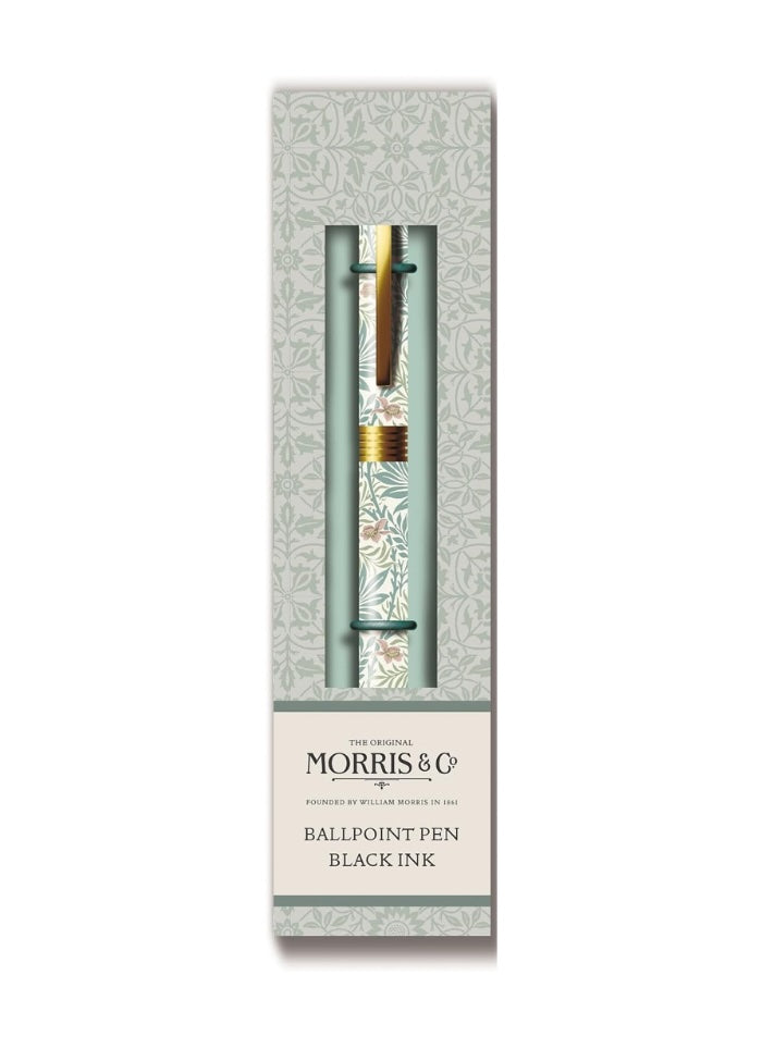 Ballpoint pen with decorative cap in a branded box on a white background