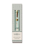 Ballpoint pen with decorative cap in a branded box on a white background