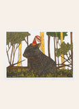 Wombat in trees on grass