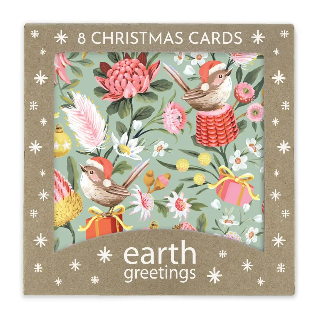 A boxed set of 8 Christmas greeting cards from earth greetings, featuring a festive illustration of small birds in Santa hats among pink flowers, green leaves, and gift boxes on a kraft paper package.