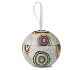 A Christmas ball with Aboriginal art and hanging ribbon