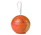 A christmas ball decoration with ribbon to hang.
