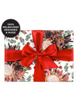Gift wrap with floral design and red ribbon, featuring '100% Melbourne Designed & Made' label.