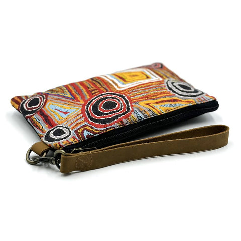 A small canvas purse produced by Better World Arts and based on artwork by Mary Napangardi Brown.