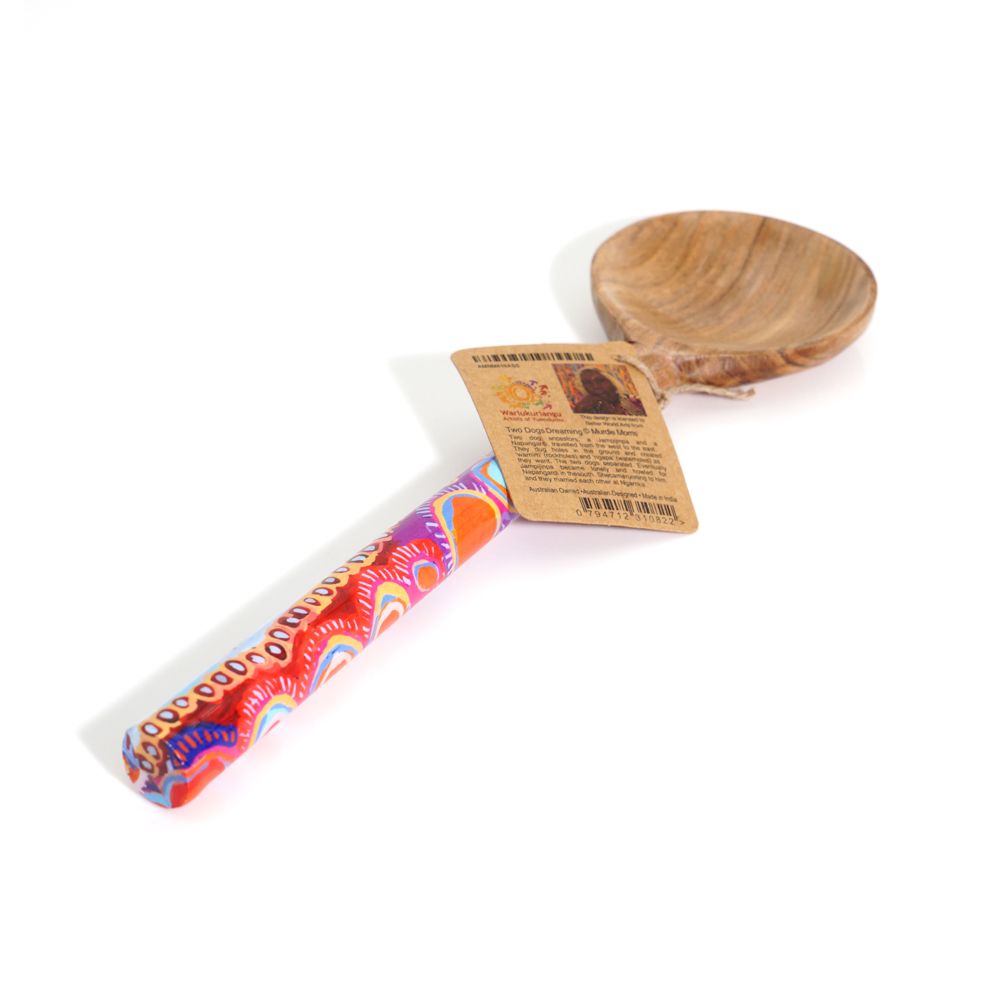 Colorful rolled product with a wooden spoon and label on a white background