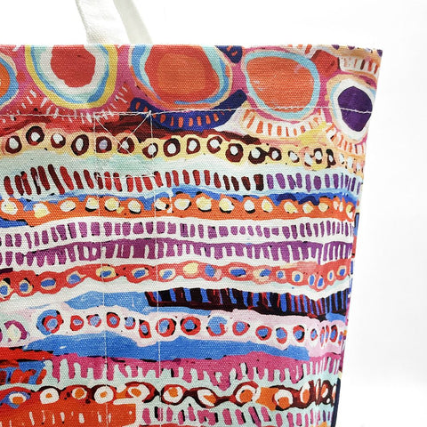 Close up of a tote bag produced by Better World Arts and based on artwork by Murdie Nampijinpa Morris.