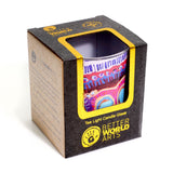 Colorful tea light candle glass in a Better World Arts box on a white background