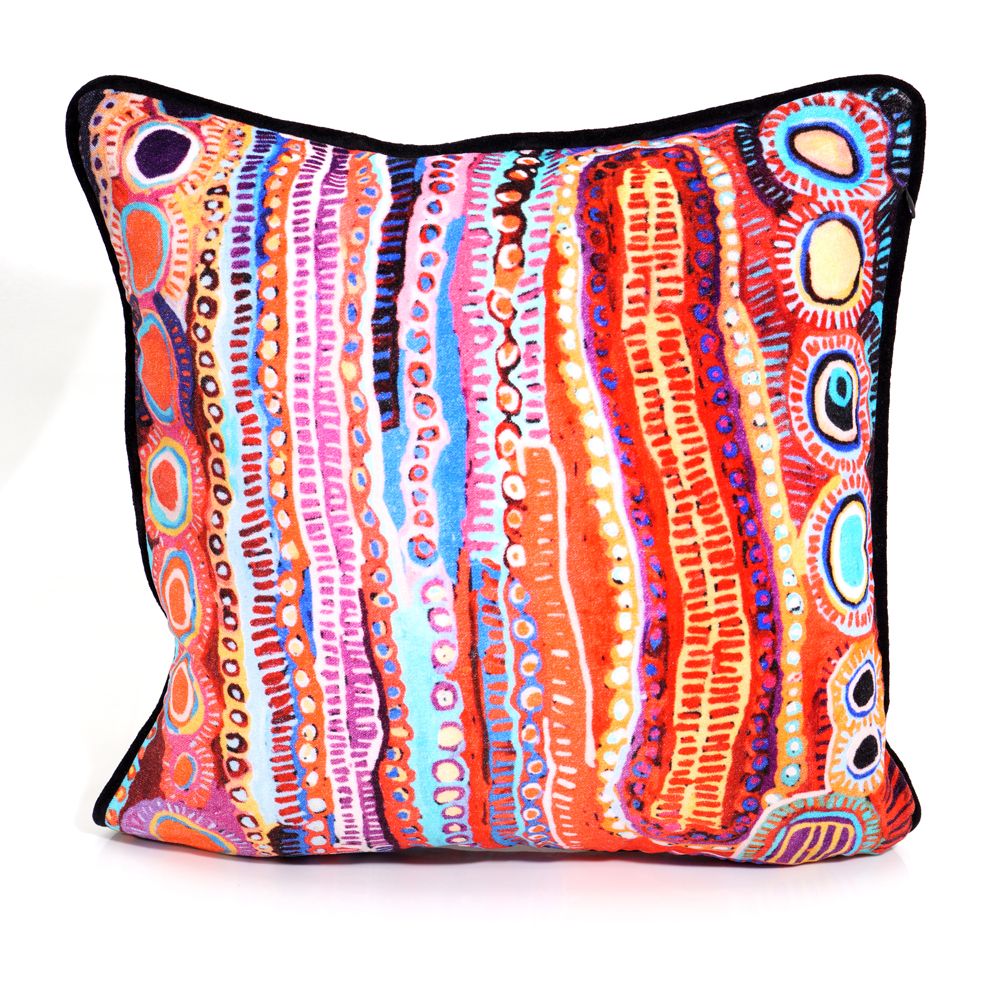 Colorful patterned pillow with a white background