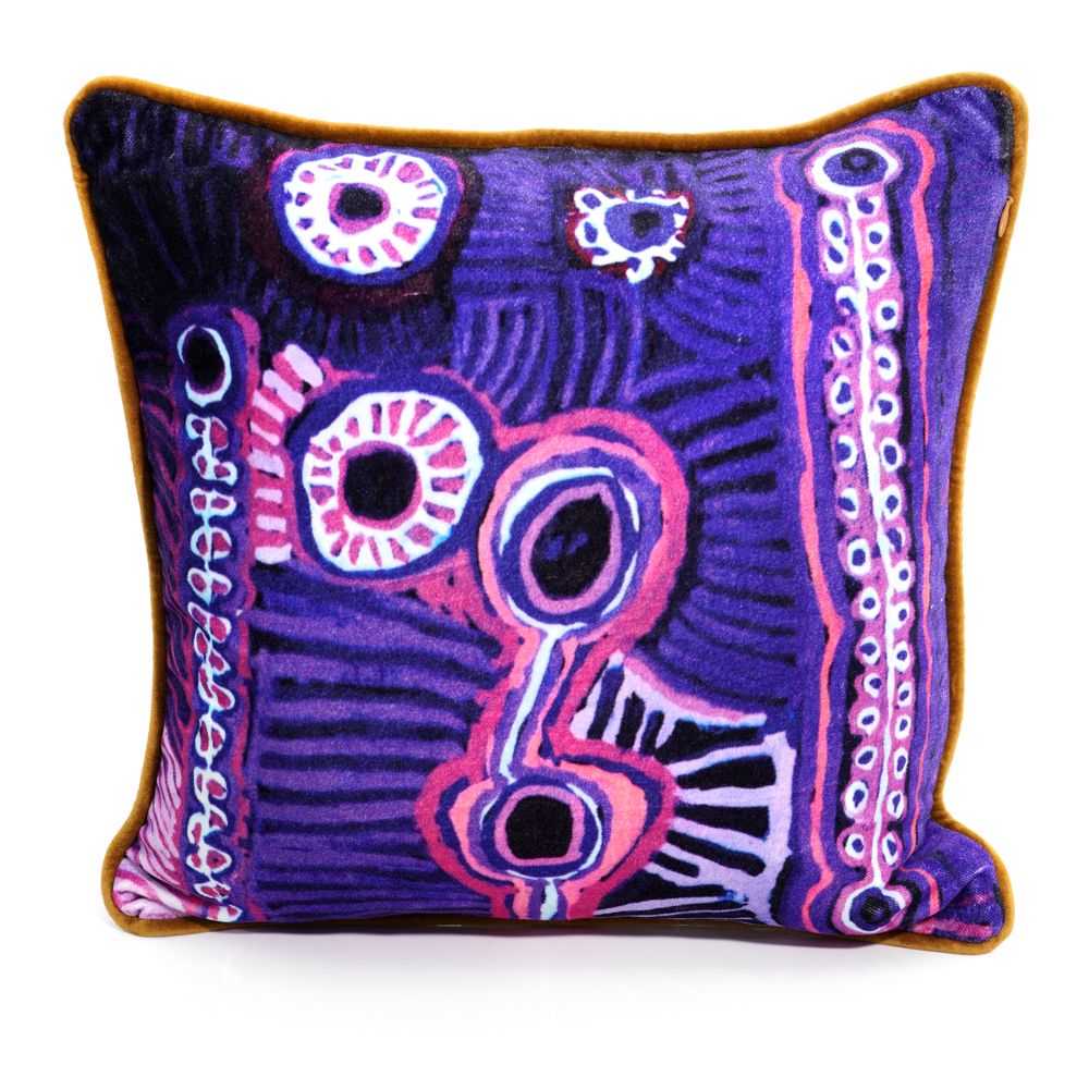 Decorative pillow with purple and pink abstract pattern on a white background