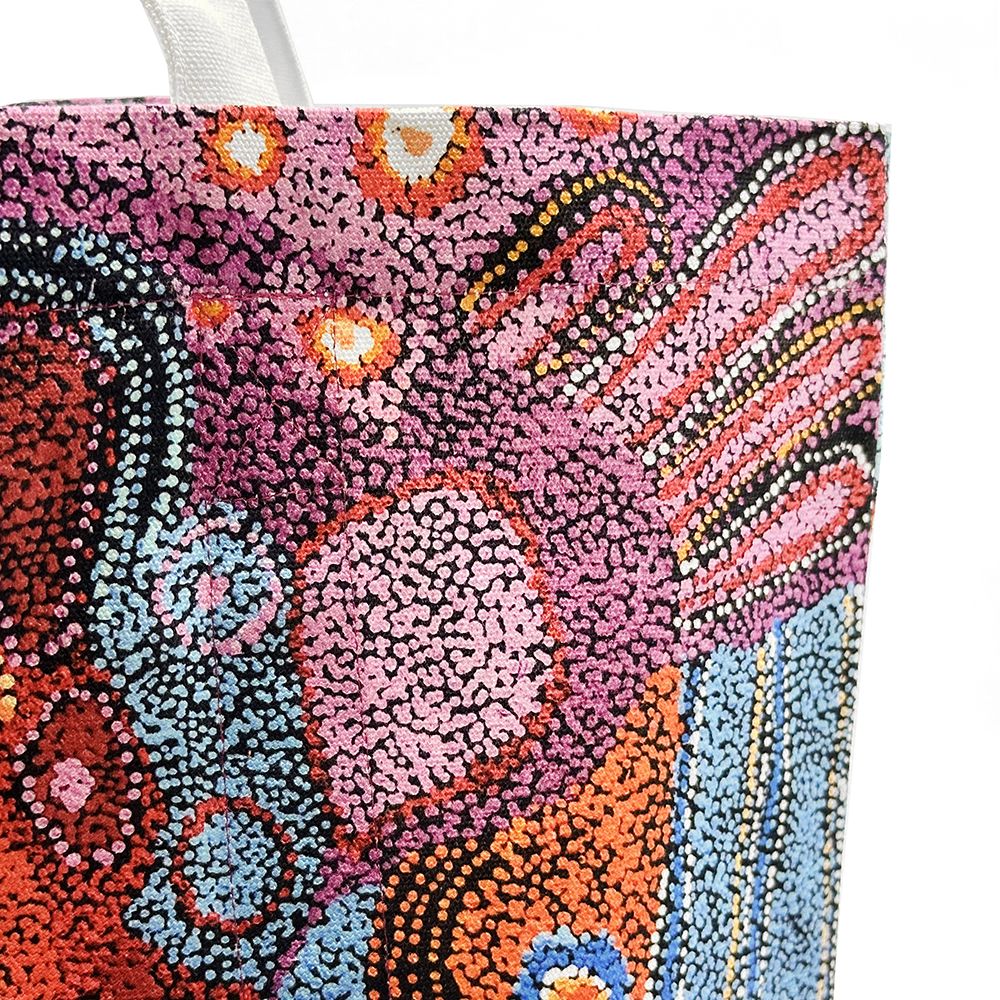 Close up of a canvas tote bag from Better World Arts and based on artwork by Andrea Mimpitja Adamson