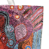 Close up of a canvas tote bag from Better World Arts and based on artwork by Andrea Mimpitja Adamson