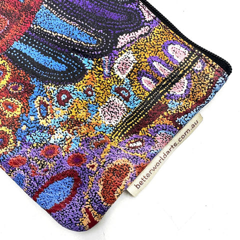Colorful textured pouch with a brand tag on a white background