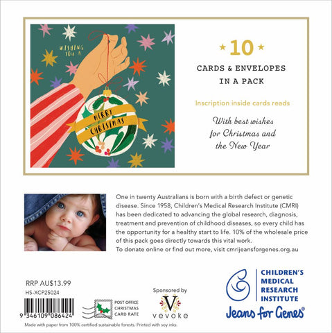 Christmas card packaging with a hand holding a Christmas ornament and text about Children's Medical Research Institute.