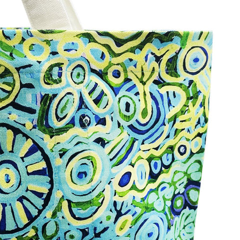 Close up of a canvas tote bag from Better World Arts and based on artwork by Cedric Varcoe.