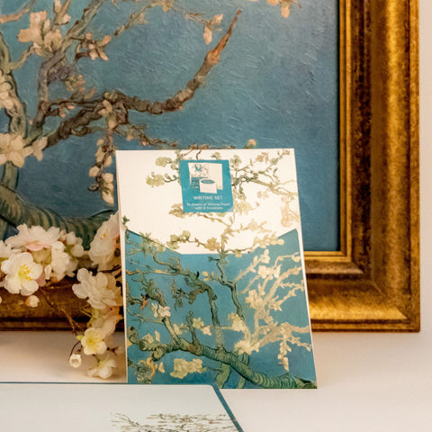 Card with Van Gogh's 'Almond Blossom' design in front of a framed painting