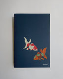Notebook with goldfish illustration on a plain background