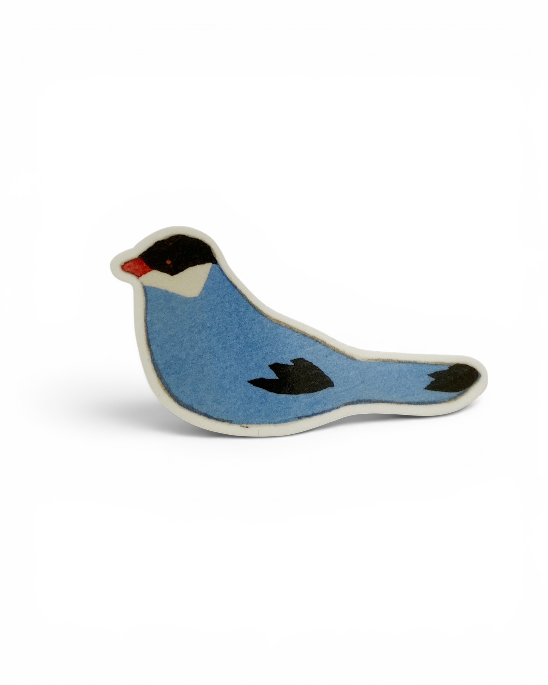 Blue bird-shaped object on a white background