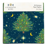 A pack of paper napkins with a green tree with decorations on a dark blue background with stars and moons.