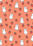 Pattern of cartoon bunnies and strawberries on a peach background