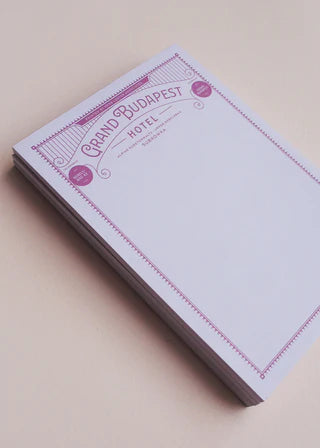 Notebook with 'Grand Budapest Hotel' design on a beige background