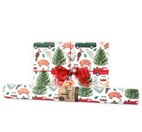Gift and roll of wrapping paper with Australian animals and christmas trees