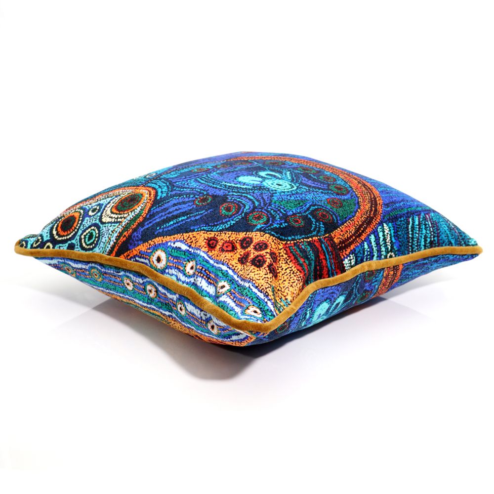 Decorative pillow with intricate patterns on a white background