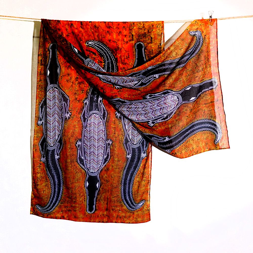 An organic cotton scarf with artwork by Edward Malati Yunupingu.