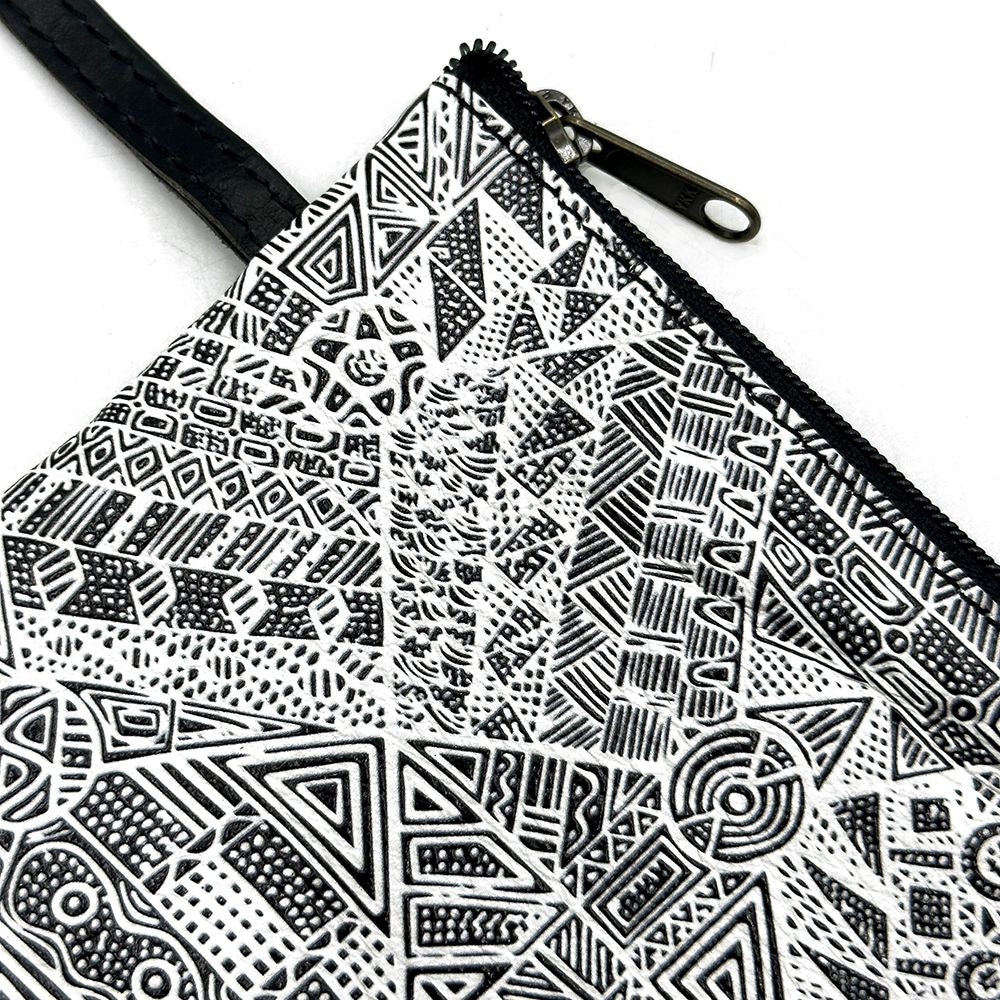 Zipper pouch with black and white geometric pattern on a white background