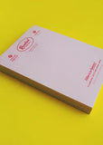 Notebook with a brand logo on a yellow background