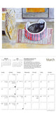 Calendar page for March with a cat in a bowl and a pie on a table.