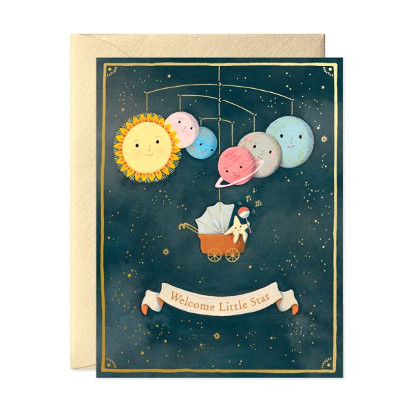 Greeting card with space-themed illustration of planets and sun, featuring a baby in a stroller under a banner that says 'Welcome Little Star'.